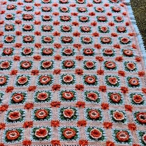 Beautiful crocheted peach colored blanket flowers aphan.  Size 30x60"